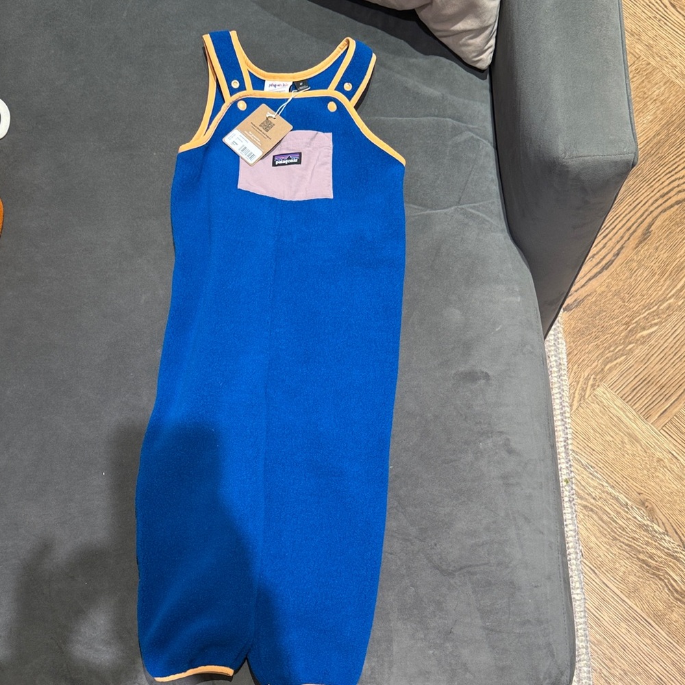 Patagonia Blue Romper with Pink Pocket and Yellow Trim